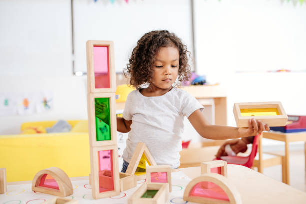 istock Toddler is working on new wooden project 930495638