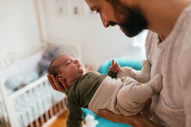 Father putting his baby to sleep