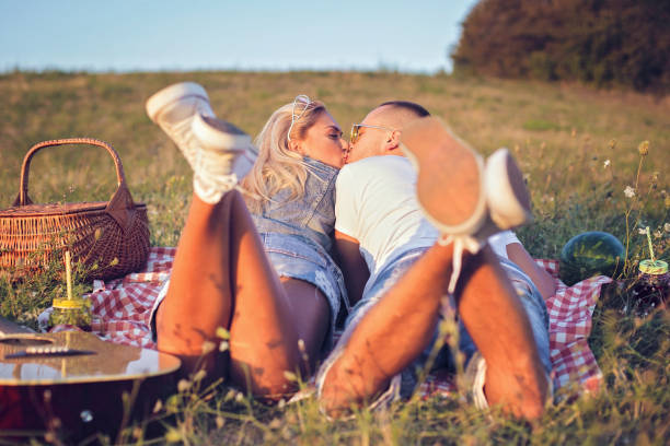 istock Couple kissing in nature 930507664