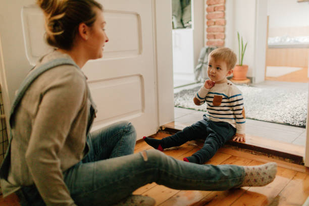 istock Mother and son playing on the floor 930507756