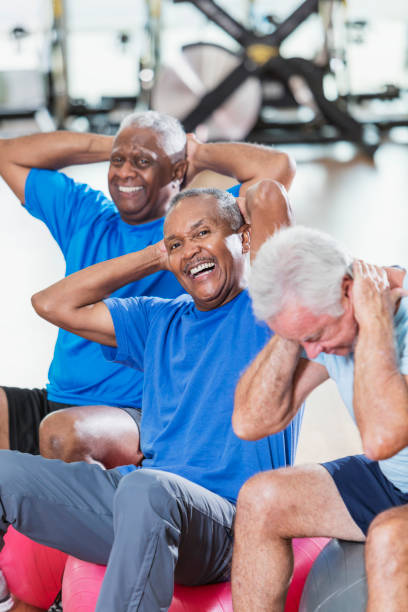 istock Three multi-ethnic senior men in gym exercising 930515004