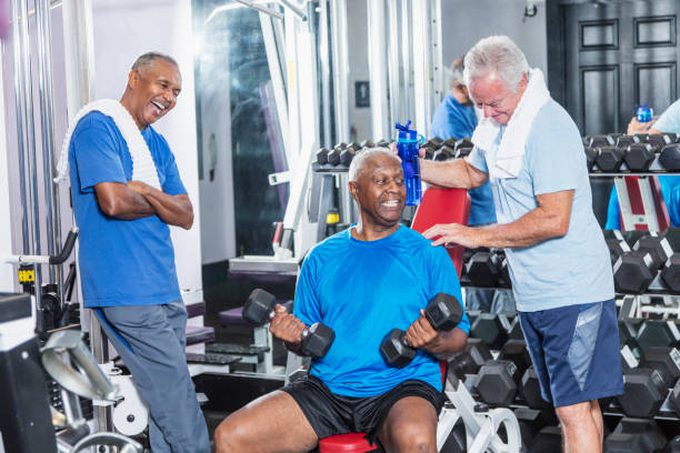 istock Three senior multi-ethnic men working out at gym talking 930515374