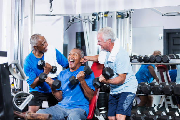 istock Three senior multi-ethnic men working out at gym talking 930515442