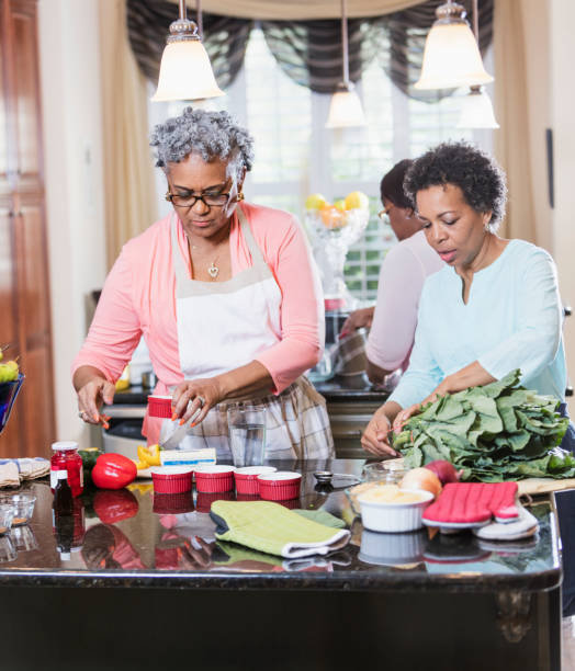 istock African-American women in kitchen cooking 930515542