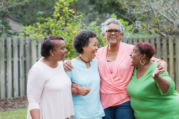 istock Four African-American women standing outdoors together 930517834