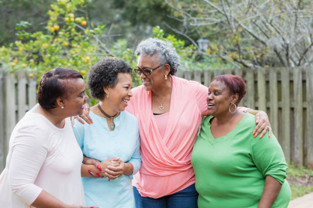 istock Four African-American women standing outdoors together 930518122