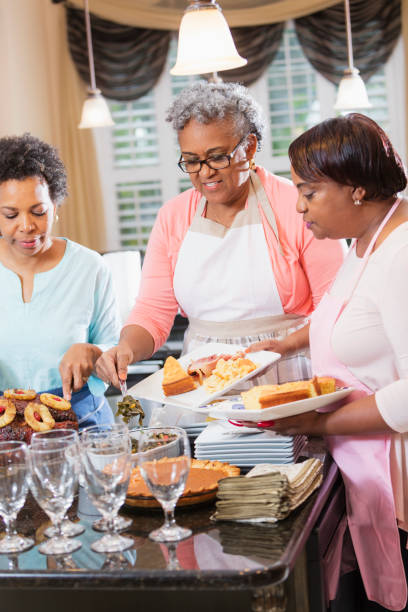 istock African-American women serving home cooked meal 930518584