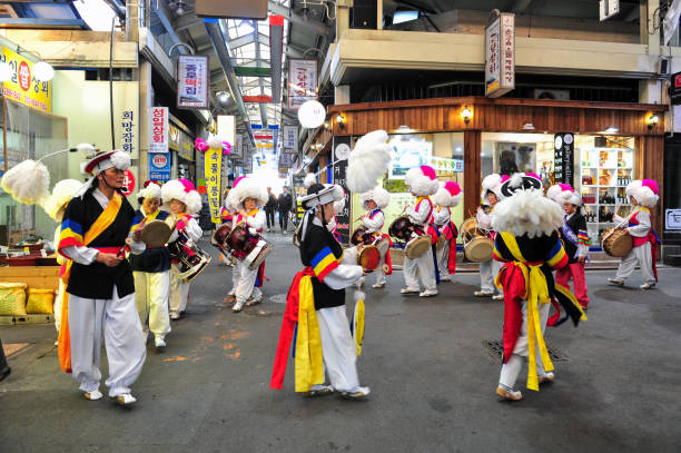 Jeonju Nambu Market's Pungmul Band performing at a Nambu traditional market stock photo