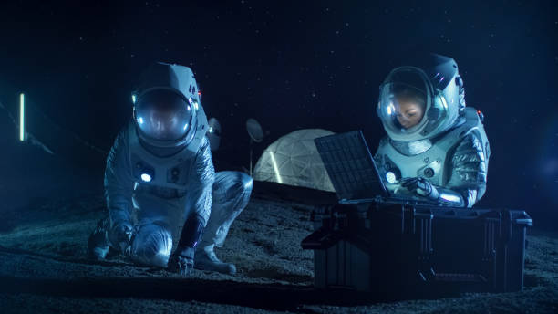 istock Two Astronauts Collect Rocks and Soil Samples on the Alien Planet. Space Travel and Exploration, Finding Habitable Planet, Colonization Concept. 930523142
