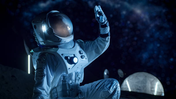 istock Astronaut is Looking at Recently Found Rock Sample on the Alien Planet. Space Travel and Exploration, Finding Habitable Planet, Colonization Concept. 930523254