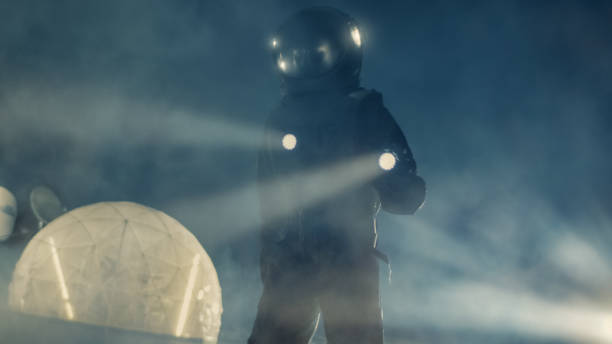 istock Courageous Astronaut in the Space Suit Holds Flashlight and Explores Alien Planet Covered in Mist and Smoke. Adventure. Interstellar Space Travel, Habitable World and Extraterrestrial Colonization Concept. 930523332