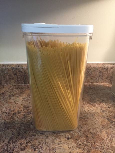 istock Organizational plastic container with spaghetti noodles in it to make kitchen more clean 930523374