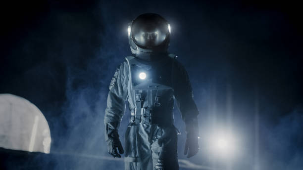 istock Courageous Astronaut in the Space Suit with Flashlight Explores Mysterious Alien Planet Covered in Mist. Adventure. Space Travel, Habitable World and Colonization Concept. 930523432