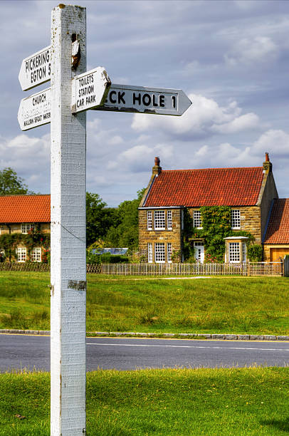 istock English cottage and street 93052369