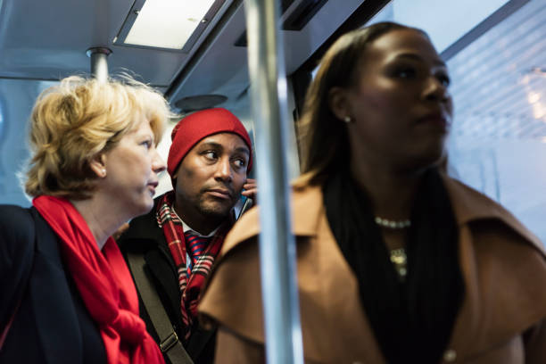 istock African-American man on train, using mobile phone 930526526