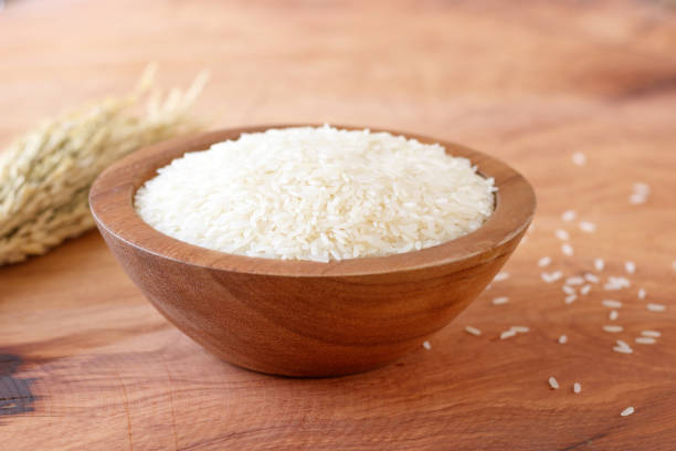 istock White rice in bowl on wooden background. 930527308