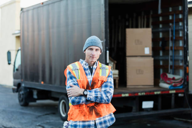 istock Mature man working, standing by delivery truck 930527606