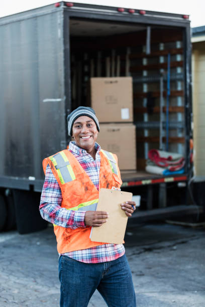 istock African-American man working, with delivery truck 930527814