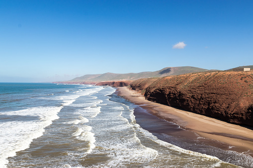 Stone arch and red cliffs near Sidi Ifni