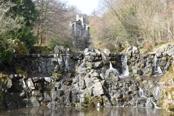 Photo of Small stone wall with a beautiful waterfall at World Cultural Heritage Herkules in Kassel, Wilhelmshöhe, Germany