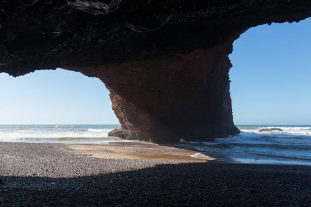 istock Stone arch in red cliffs near Legzira, Sidi Ifni, Morocco 930531008