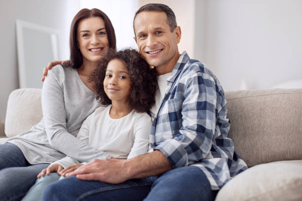 istock Cheerful family sitting on the sofa 930546368