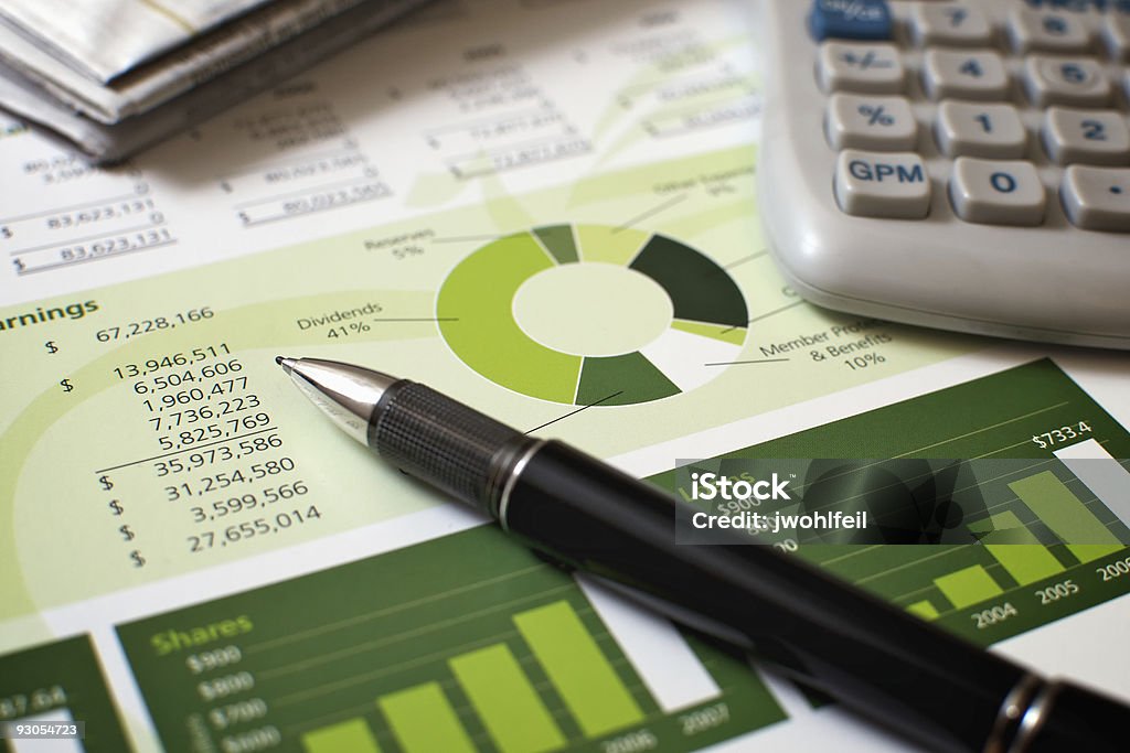 Black pen with financial figures and calculator http://www.johnwphotography.com/Images/financialplanning.jpg Credit Union Stock Photo