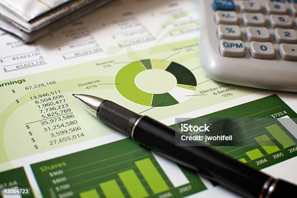 Black Pen With Financial Figures And Calculator Stock Photo - Download Image Now - Credit Union, Green Color, Banking