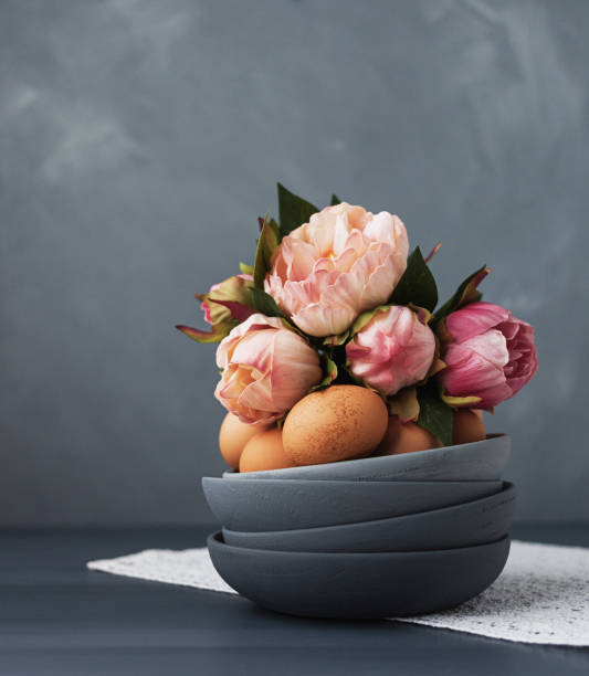 istock Gray ombre bowls with eggs and peony bouquet 930552178