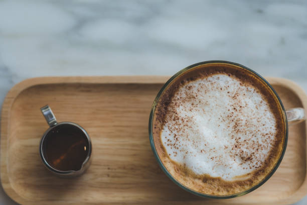 istock top view modern hot coffee in cup on table in coffee shop. 930552218