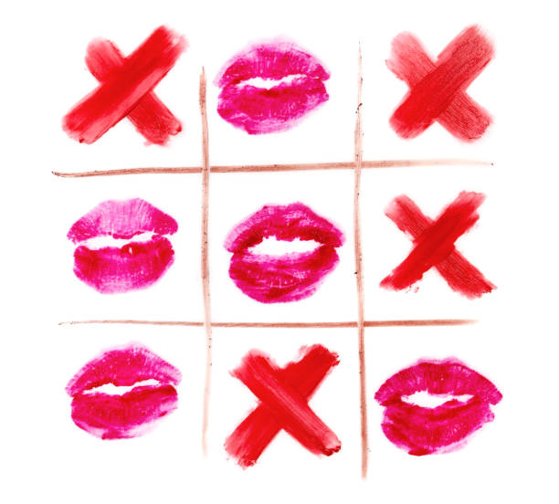 top view of tic-tac-toe with black crosses and lips prints top view of tic-tac-toe with black crosses and lips prints isolated on white cross match stock pictures, royalty-free photos & images