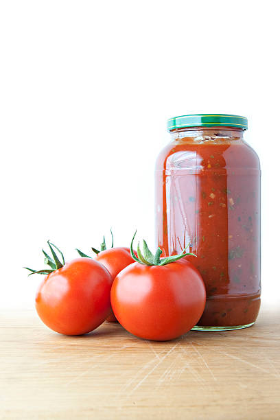 istock Tomato Sauce and Ripe Tomatoes on Wood 93055274