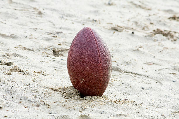 istock Football In Sand 93055416
