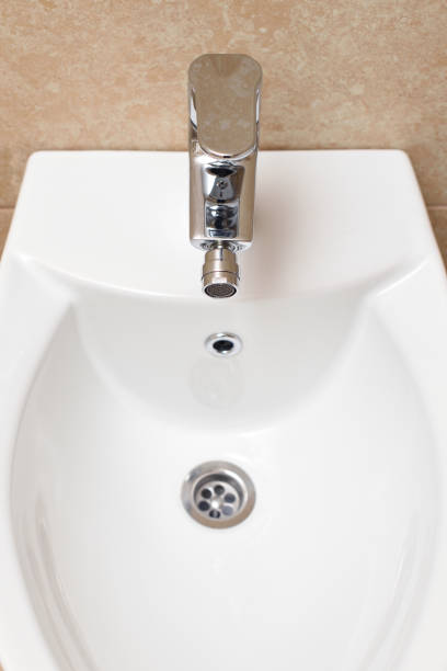 istock Bidet is white in the bathroom, new. 930559950