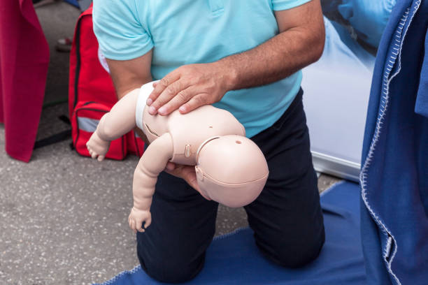Baby or child first aid training for choking stock photo