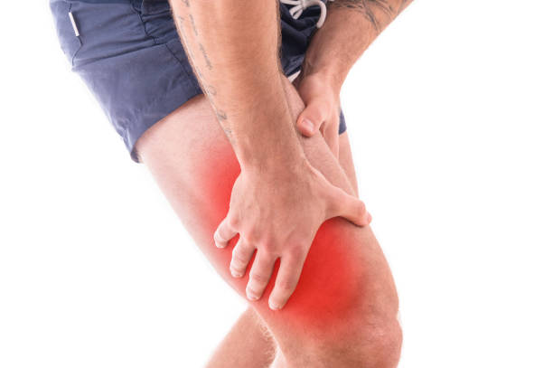 istock Man with quadriceps pain over white background 930568576