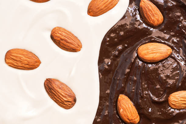 istock Texture of melted black and white chocolate with almonds. 930568786