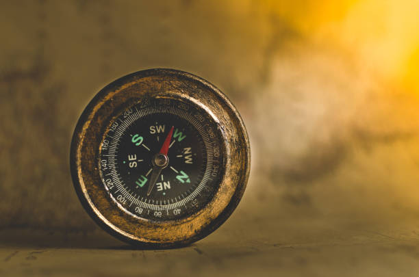 istock Compass on the background of old maps 930571088