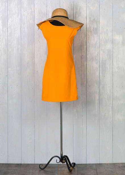 a yellow dress on a mannequin