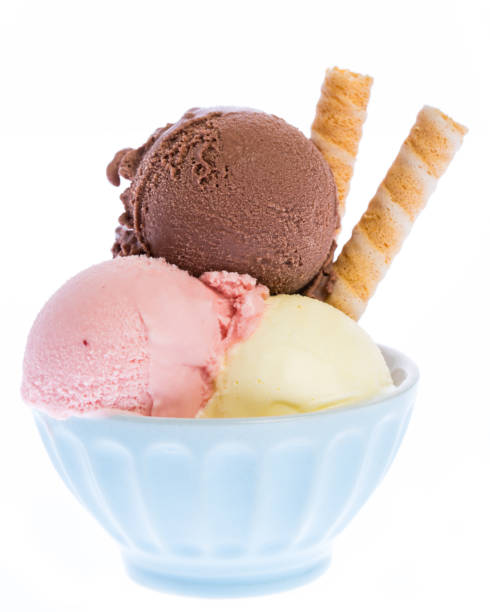 istock Three scoops of real ice cream with waffles in blue bowl 930575056