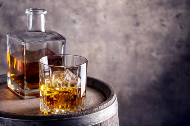 istock Glass and decanter of whiskey aged 930575268