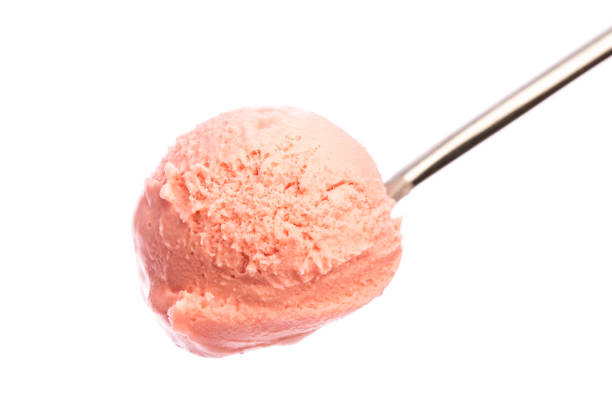 istock ice cream: Strawberry ice cream on a spoon isolated on white background 930576078