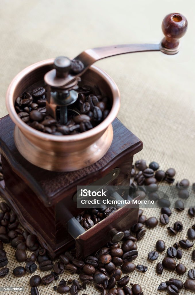 Wooden coffee grinder and coffee beans wooden coffee grinder and coffee beans backgroun Backgrounds Stock Photo