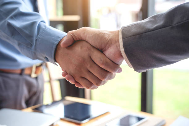 istock Business shaking hands. Business executives to congratulate the joint. 930579238