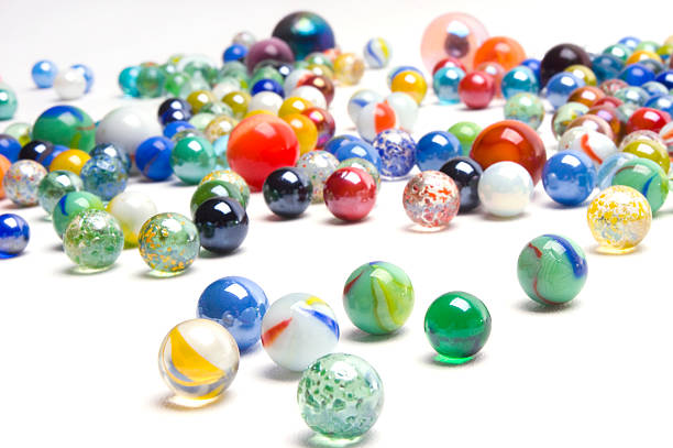 Marbles  marble sphere stock pictures, royalty-free photos & images