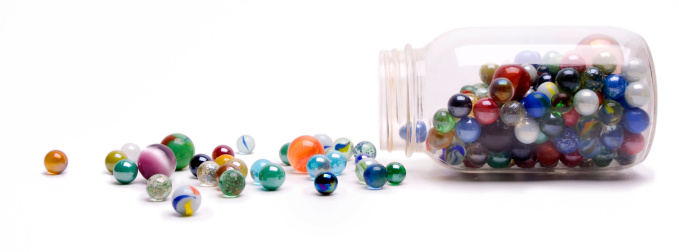 colored glass beads on white background
