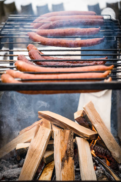 istock Pork and beef sausages being grilled 930582534