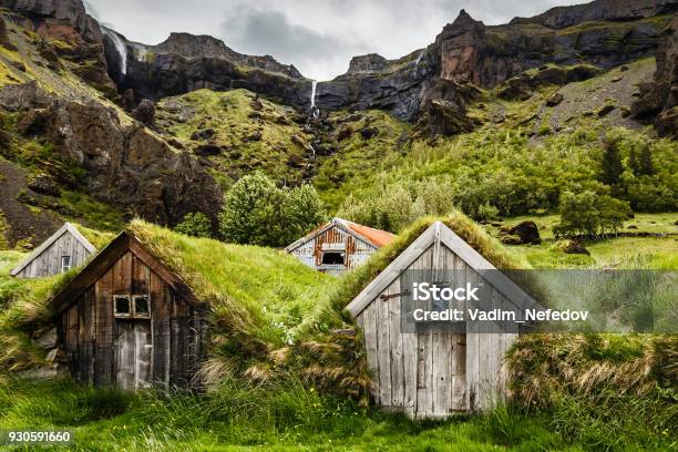 Icelandic Turf Houses And Rocky Canyon With Waterfall In The Background Near Kalfafell Vilage South Iceland Stock Photo - Download Image Now