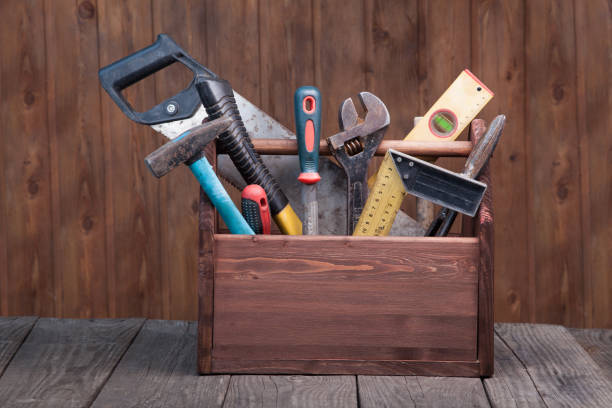 istock grungy old tools on a wooden background front view. 930591698