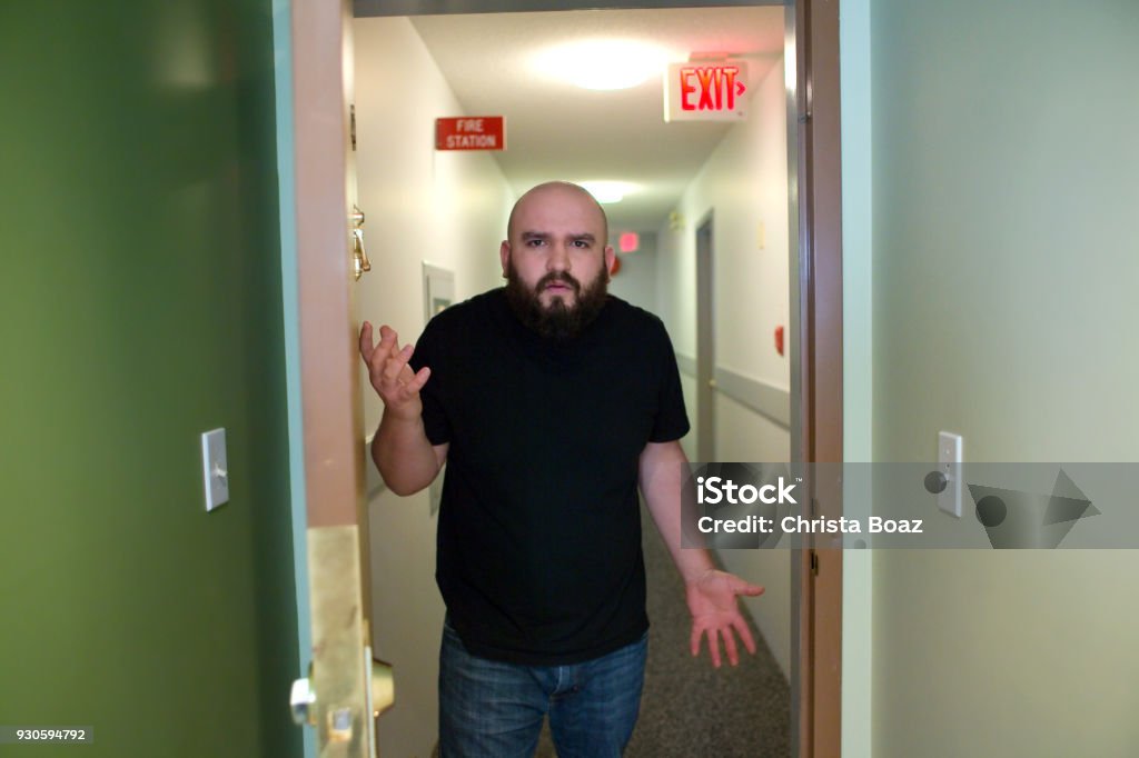 Unhappy Neighbor A neighbor complains about noise, etc. Apartment Stock Photo Unhappy Neighbor A neighbor complains about noise, etc. Apartment Stock Photo